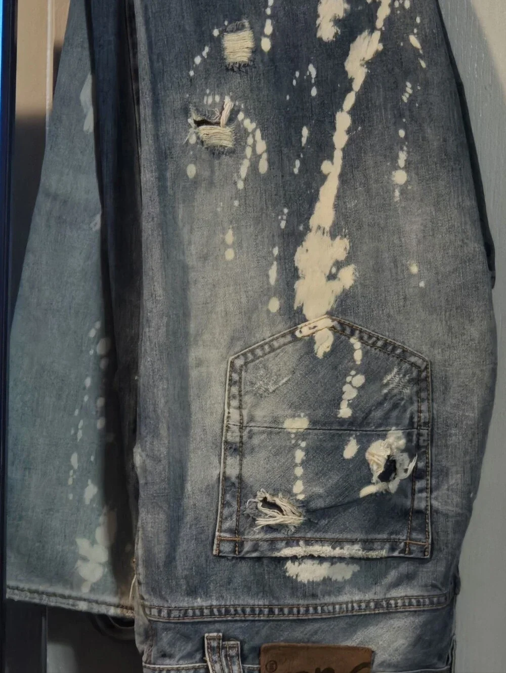 Men's Distressed Blue Denim Jeans with Bleach Splatter